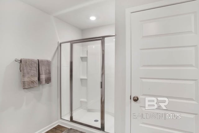 bathroom with a shower stall