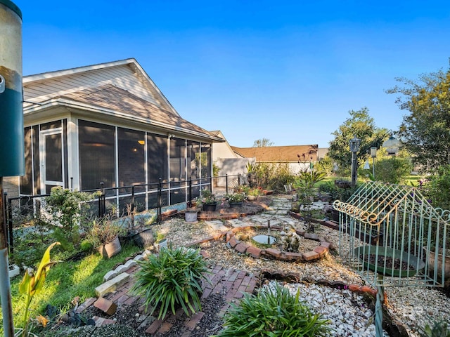 view of yard featuring a sunroom