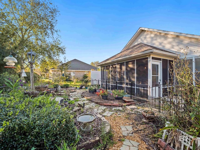 view of yard with a sunroom