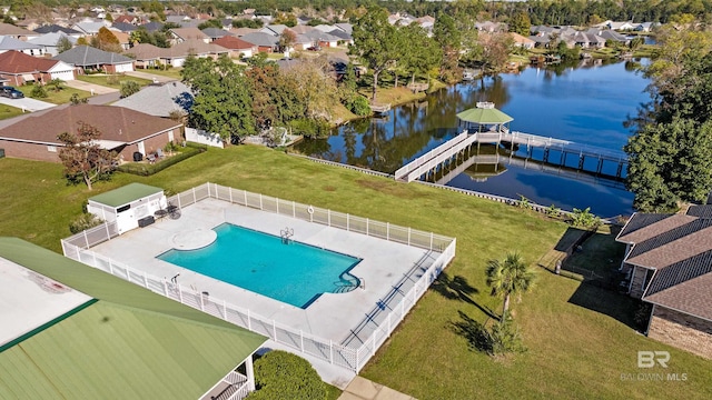 view of swimming pool featuring a water view