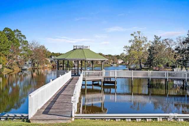 view of dock featuring a gazebo and a water view