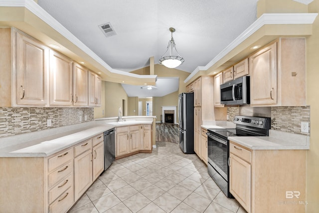 kitchen featuring decorative backsplash, light brown cabinetry, stainless steel appliances, and sink