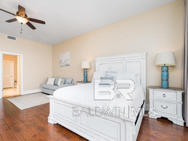 bedroom featuring ceiling fan and dark hardwood / wood-style flooring