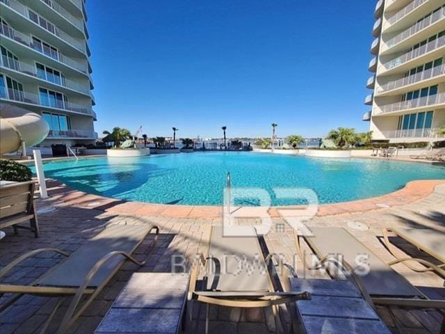 view of pool featuring a patio