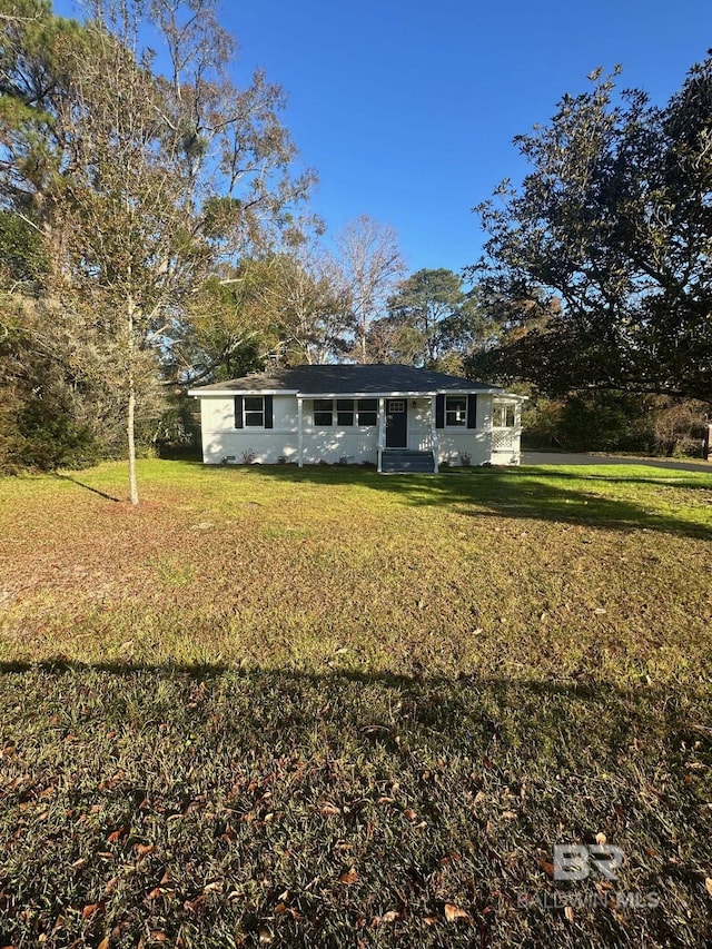 view of front of property with a front lawn