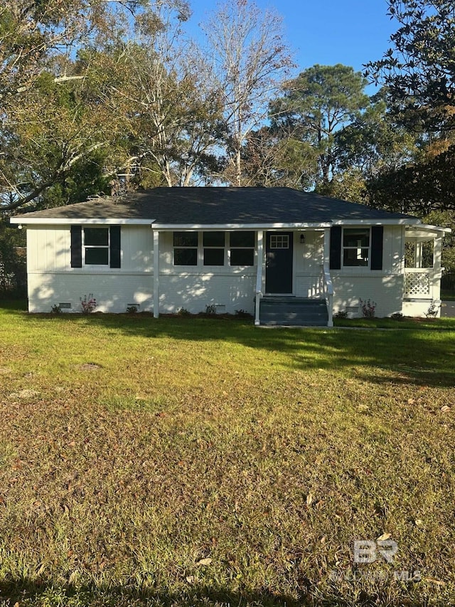 ranch-style house with a front lawn