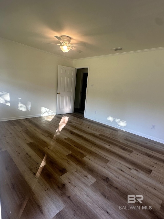 unfurnished room with hardwood / wood-style flooring, ornamental molding, and ceiling fan