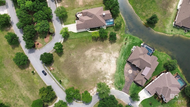 aerial view of property's location featuring a nearby body of water