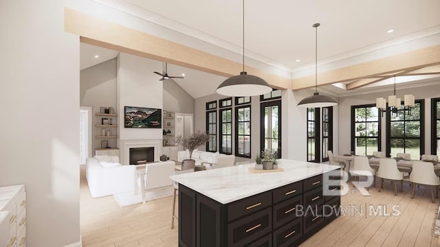 0 Olde Park Rd, Gulf Shores, AL 36542 - kitchen with dark cabinetry, light wood-type flooring, light countertops, decorative light fixtures, and a center island