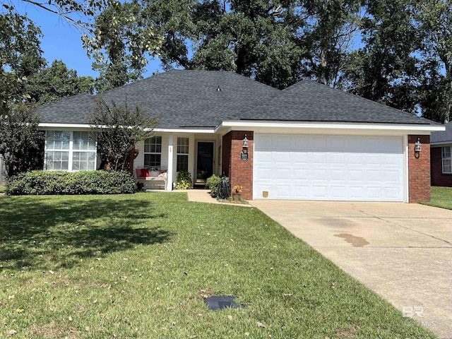 single story home featuring a front lawn and a garage