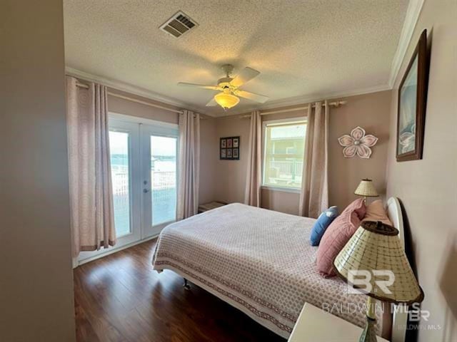 2800 W Beach Blvd, Gulf Shores, AL 36542 - bedroom with visible vents, wood finished floors, a ceiling fan, access to exterior, and french doors