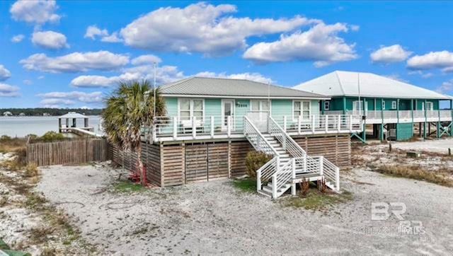 2800 W Beach Blvd, Gulf Shores, AL 36542 - view of front of house with fence and stairs