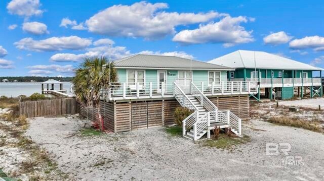 2800 W Beach Blvd, Gulf Shores, AL 36542 - view of front facade featuring fence and stairway
