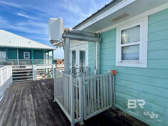 2800 W Beach Blvd, Gulf Shores, AL 36542 - wooden deck with french doors