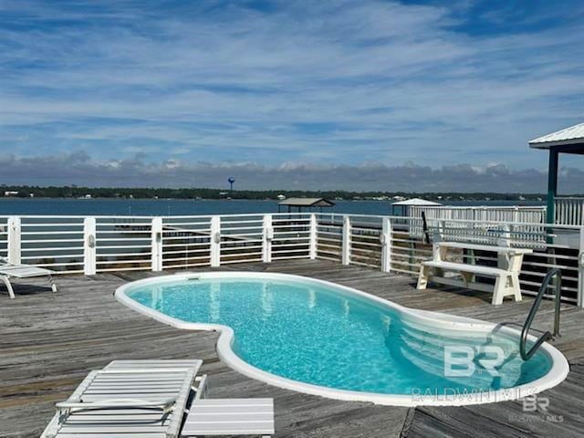 2800 W Beach Blvd, Gulf Shores, AL 36542 - view of swimming pool featuring a deck with water view and a fenced in pool