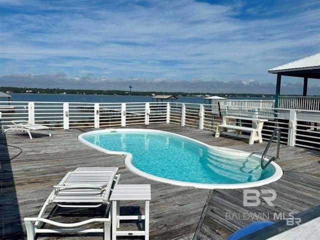 2800 W Beach Blvd, Gulf Shores, AL 36542 - view of pool featuring a deck with water view and a fenced in pool