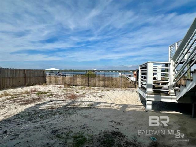2800 W Beach Blvd, Gulf Shores, AL 36542 - view of yard featuring a water view and fence