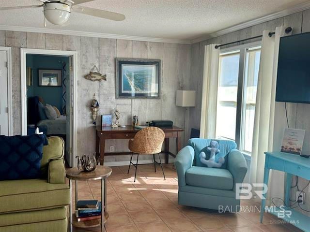 2800 W Beach Blvd, Gulf Shores, AL 36542 - sitting room with light tile patterned floors, a ceiling fan, ornamental molding, and a textured ceiling