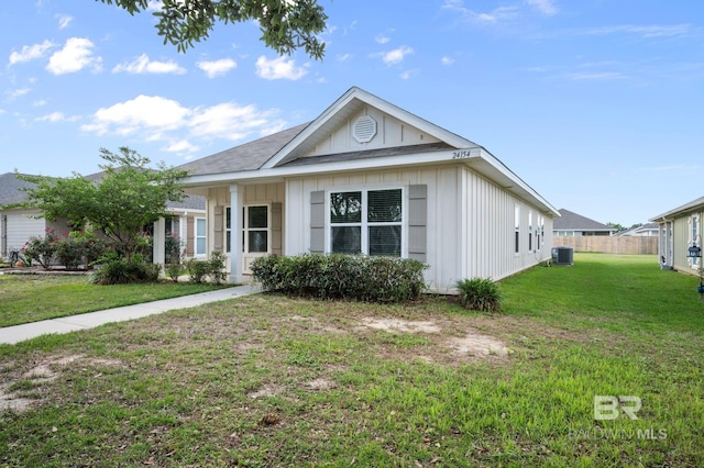 single story home with board and batten siding and cooling unit