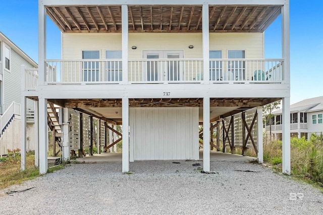 rear view of house featuring a carport