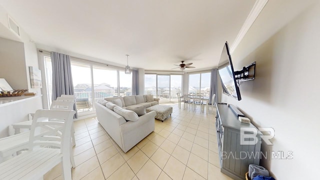 tiled living room with floor to ceiling windows, ceiling fan, and crown molding