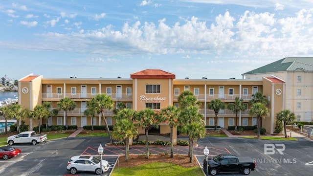28927 Perdido Beach Blvd Unit 2G, Orange Beach, AL 36561 - view of building exterior featuring uncovered parking