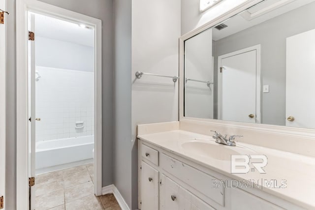 bathroom featuring visible vents, shower / bathing tub combination, vanity, tile patterned flooring, and baseboards