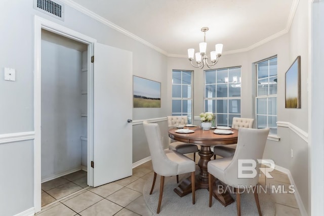 dining space featuring light tile patterned floors, a notable chandelier, visible vents, baseboards, and ornamental molding