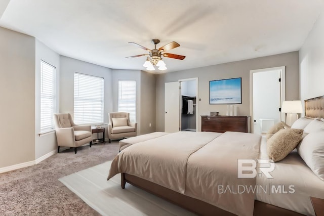 carpeted bedroom featuring ceiling fan and baseboards