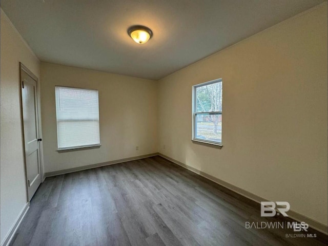 spare room with hardwood / wood-style flooring