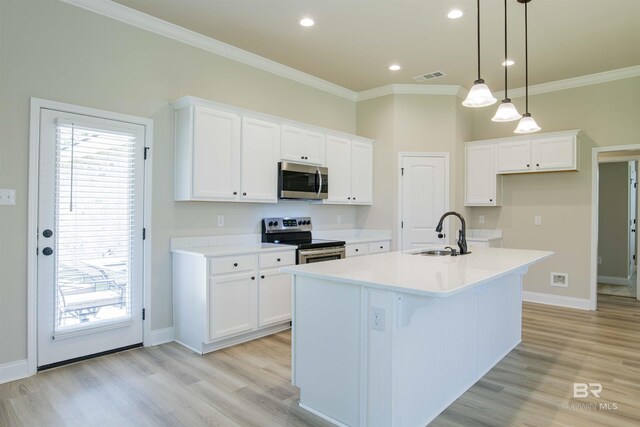 6902 Summerset Dr, Gulf Shores, AL 36542 - kitchen featuring stainless steel appliances, a sink, ornamental molding, white cabinetry, and light wood-type flooring