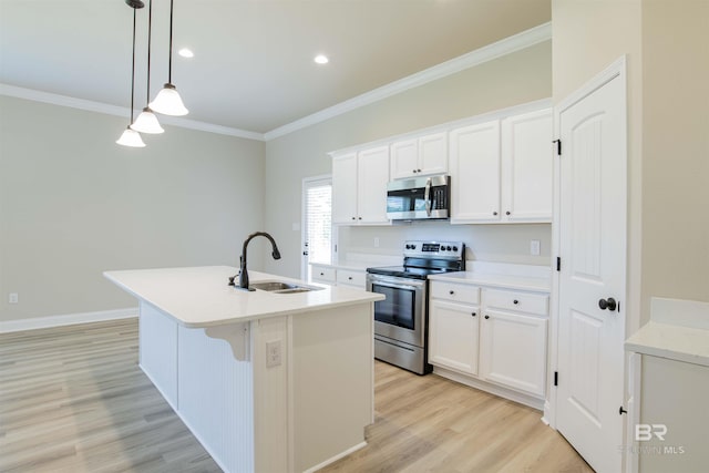 6902 Summerset Dr, Gulf Shores, AL 36542 - kitchen with appliances with stainless steel finishes, a sink, ornamental molding, a kitchen island with sink, and white cabinets