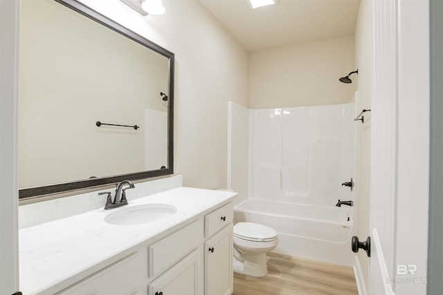 6902 Summerset Dr, Gulf Shores, AL 36542 - bathroom featuring wood finished floors, toilet, shower / washtub combination, and vanity