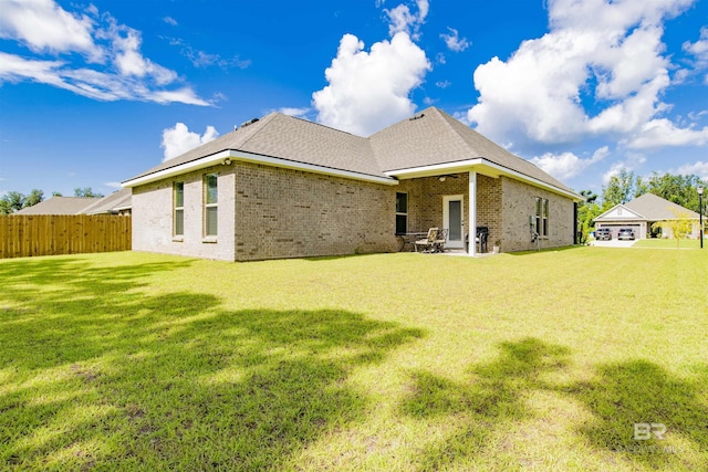 6902 Summerset Dr, Gulf Shores, AL 36542 - rear view of house with brick siding and a patio