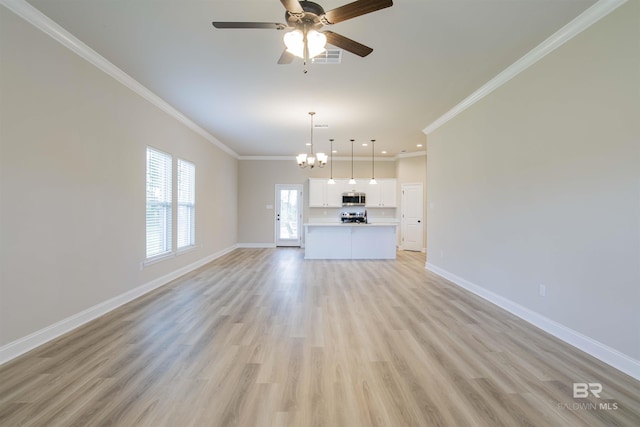 6902 Summerset Dr, Gulf Shores, AL 36542 - unfurnished living room featuring baseboards, ornamental molding, a chandelier, a ceiling fan, and recessed lighting