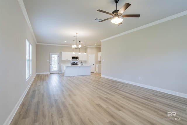 6902 Summerset Dr, Gulf Shores, AL 36542 - unfurnished living room featuring baseboards, a chandelier, crown molding, recessed lighting, and a ceiling fan
