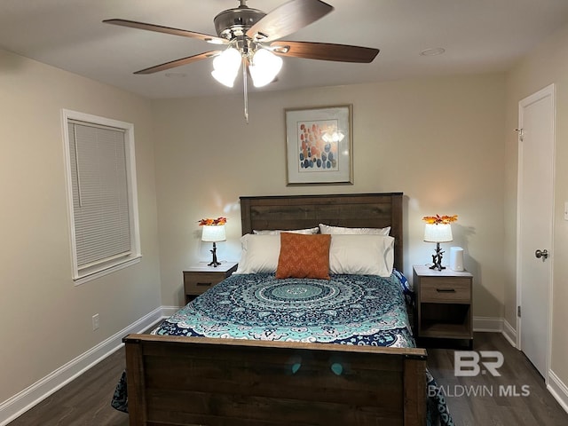 bedroom featuring ceiling fan and dark hardwood / wood-style floors