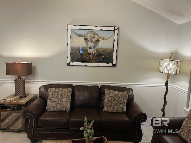 tiled living room with a textured ceiling