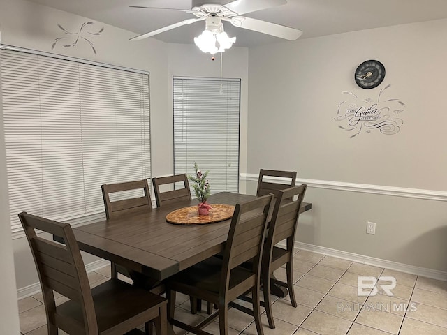 tiled dining area featuring ceiling fan