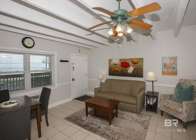 living room with ceiling fan, light tile patterned floors, a textured ceiling, and beam ceiling