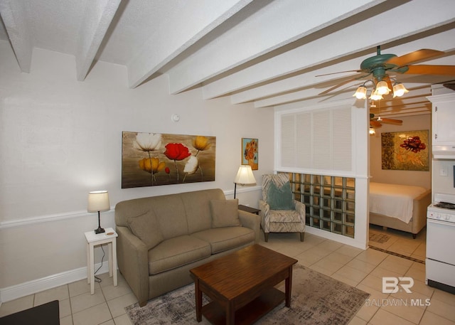 tiled living room with beamed ceiling, ceiling fan, and a textured ceiling