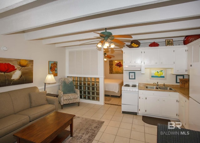 kitchen with sink, white appliances, light tile patterned floors, white cabinetry, and beam ceiling