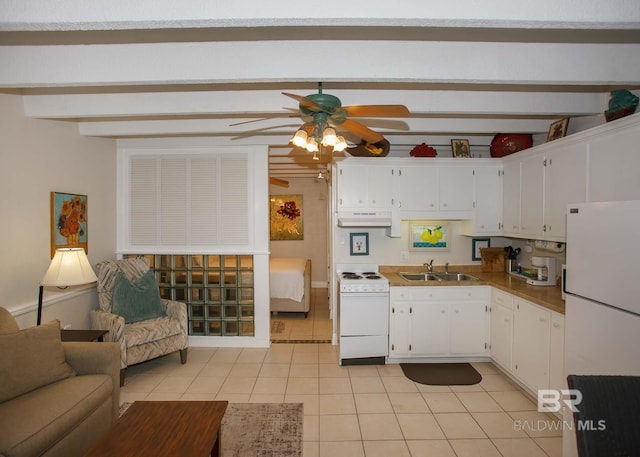 kitchen with white cabinetry, sink, light tile patterned floors, and white appliances