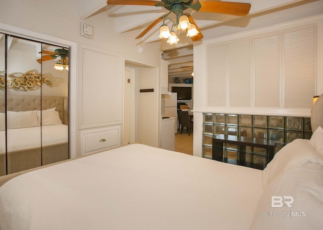 bedroom with ceiling fan and a closet