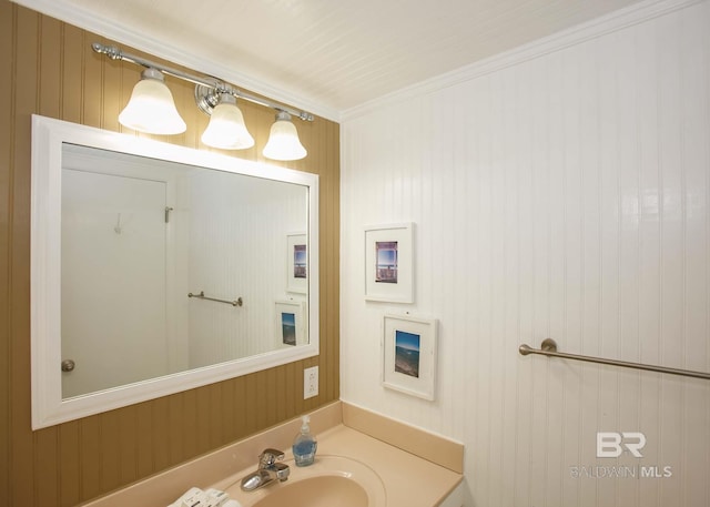 bathroom with sink and crown molding