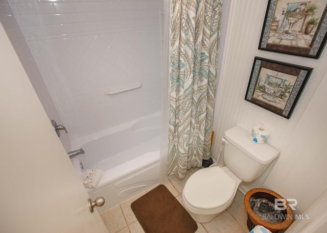 bathroom with toilet, tile patterned floors, and shower / bath combo with shower curtain