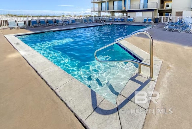 view of swimming pool featuring a patio