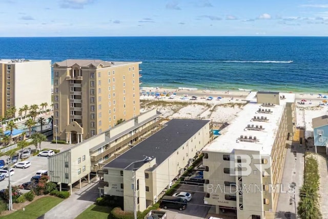 bird's eye view with a water view and a view of the beach