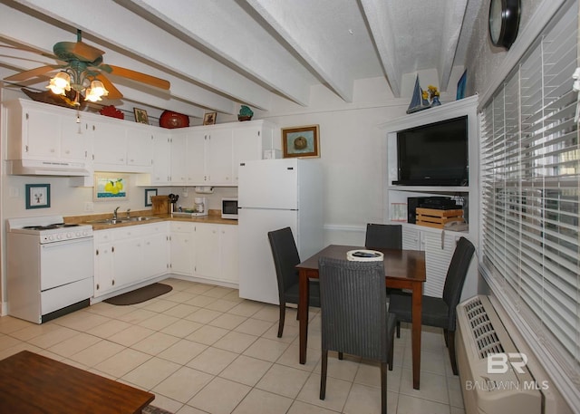 kitchen with white appliances, light tile patterned floors, sink, and white cabinets