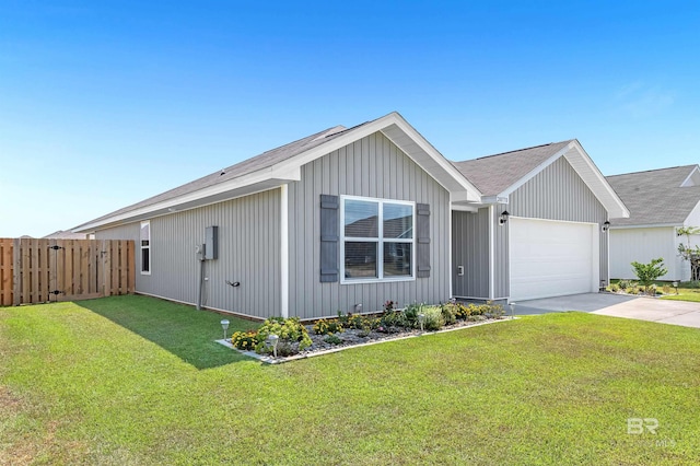 20770 Mercury Dr, Robertsdale, AL 36567 - view of front of property featuring a garage, driveway, and a shingled roof